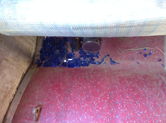 Glass that I shook off my lap onto the floor.