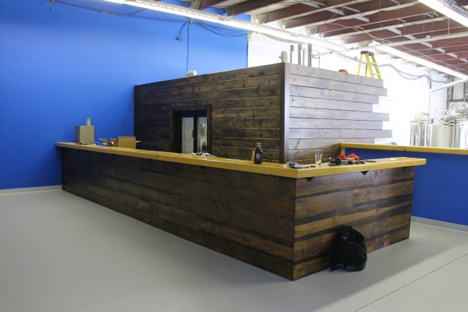 The bottle room still in progress, but see those planks. They're (at least) a century old! How cool is that?